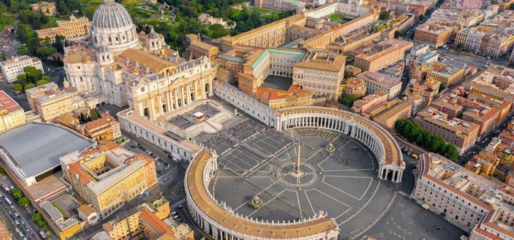 St. Peter's Square in Vatican City surrounded by Bernini's curved Baroque colonnades.
